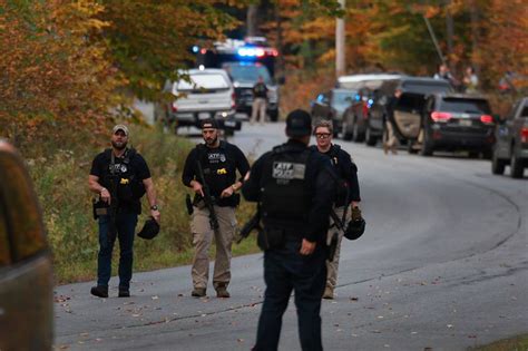 Heavily armed police surround home in search for suspect in the deadly Maine shootings